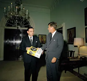 George Prints: Representative Edward P. Boland of Massachusetts presents Websters International Dictionary to President Kennedy