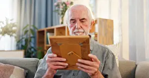 Contemplating Prints: Retirement, senior man and frame with nostalgia