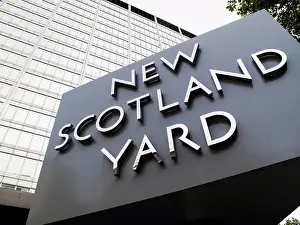 Justice Prints: Revolving sign, New Scotland Yard, St James; London, England