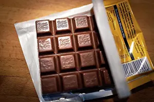 Symbolic Pictures Prints: Ritter Sport chocolate lies unwrapped in a package on a kitchen worktop in Berlin