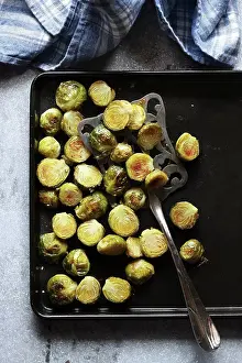Ingredient Prints: Roasted brussels sprouts on a pan.Top view