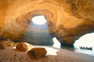 Small Group Of People Prints: Rock cave with hole, Benagil, Algarve, Portugal