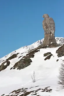 Alps Prints: Rock Eagle monument, in snow on top of mountain pass