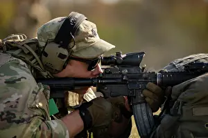 Shooting Prints: A round ejects from the chanmber as Staff Sgt