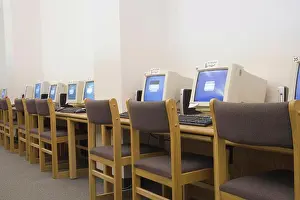 Desk Prints: A row of computers in school library