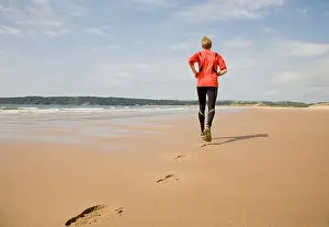 Apparel Prints: Runner making footprints on beach