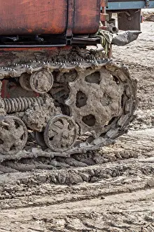 Stationary Prints: Rusted metal treads on a backhoe