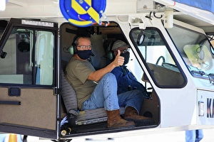 Ryan Kiechle of Jacobs Technology gives a thumbs-up inside the transporter with Orion secured atop as the spacecraft