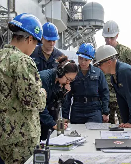 Firefighters Prints: Sailors assigned to the forward-deployed amphibious assault ship USS America (LHA 6)