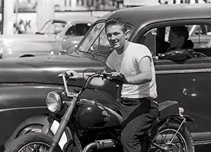 2people Prints: San Francisco, California: c. 1955 A young man on a motorcycle next to his buddy wearing a leather jacket in a car