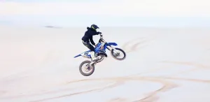 Biking Prints: Sand, jump or athlete driving motorcycle for action