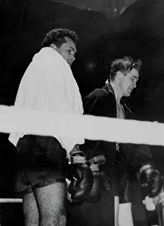 1949 Prints: Sands Outclassed by American -- Dave Sands (left) and Tommy Yarosz leaving the ring after their fight