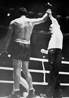 1949 Prints: Sands Wins, But Disappoints -- Dave Sands is acclaimed the winner by the referee