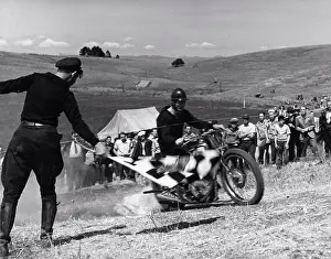 Race Prints: Santa Clara County, April 5, 1940 - Breaking the starting tape at the beginning of the Motorcycle Hill Climb