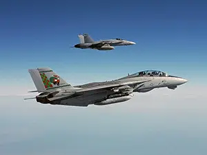 Santa Claus Prints: Santa Claus inspired tail design on an F-14, with an F/A-18 wingman flying alongside