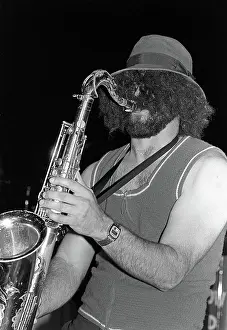 A saxophone player solos as the Navy show band performs during exercise Unitas XX