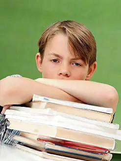 Rooms Prints: Schoolboy with a stack of books, looking frustrated, tired