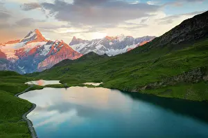 Mountains Prints: Schreckhorn and Finsteraarhorn peaks reflected in Bachalpsee lake at sunset