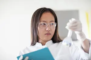 Technician Prints: scientist female with lab glasses and tablet in a lab