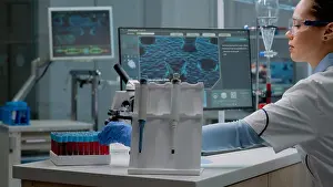 Analysis Prints: Scientist woman sitting in laboratory with chemical technology