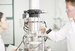 Analysis Prints: Scientists using equipment in lab