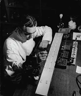 Police Prints: Scotland Yard -- Scotland Yard blood expert determining type and characteristics of blood sample