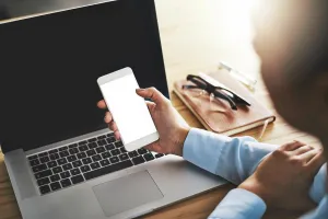 Network Prints: Screen, laptop and hands of person with phone for mockup