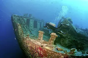 Diving Equipment Prints: Scuba diver looking at shipwreck 'SS Thistlegorm', Red Sea, Egypt, Africa