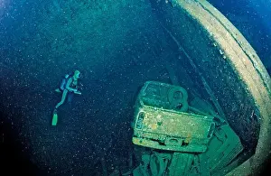 Wreck Prints: Scuba diver and Truck wreck in Blue Belt shipwreck, Sudan, Africa, Red Sea