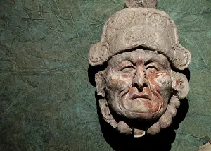 Mayan Prints: A sculpture of a man's head is displayed at the archeological museum at the ancient Mayan city of Tonina