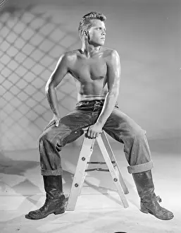 Jeans Prints: Seated Slim Shirtless Man in Jeans and Boots c.1957