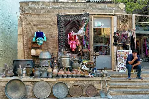 Silverware Prints: Selling pottery in the Old City of Baku, Flaming Tower in the distance, Azerbaijan