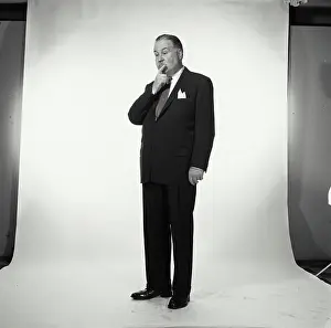 Business Suit Prints: Senior businessman thinking with hand on chin