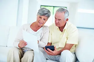 Paperwork Prints: Senior, couple and documents with calculator on sofa with budget planning