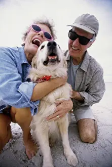 Senior Women Prints: Senior couple hugging their dog