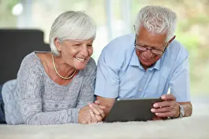 Retire Prints: Senior couple, tablet or relax in home for ebook