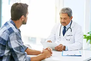 Senior doctor tablet, man patient and results with medical consultation and discussion in clinic