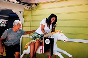 Somebody Prints: Senior woman on horse funfair ride
