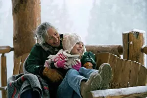 Senior Women Prints: Senior woman sitting with her granddaughter on a bench