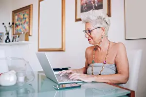 Senior Women Prints: Senior woman working at home