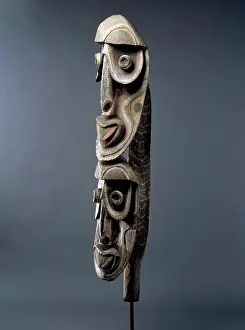 Colored Background Prints: Sepik Cult House Carving, with two large heads with bulging conical eyes