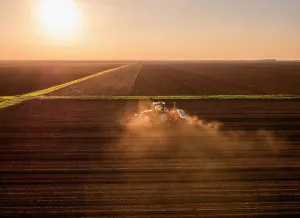 Aerial Prints: Serbia, VojvodinaProvince, Aerial view of tractor sowing seeds at sunset