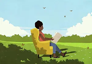 Newspaper Prints: Serene woman in armchair reading newspaper in sunny, idyllic meadow