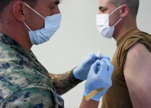 Influenza Prints: Setting the example for staff, the Commander and Director of Naval Medical Center Camp Lejeune
