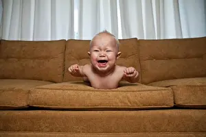 Nappy Prints: Seven month old baby on couch crying
