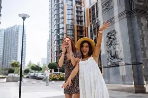 Chic Prints: Sexy carefree women posing on street background