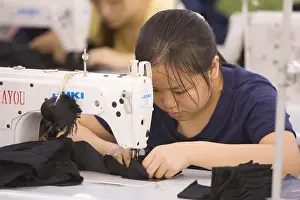 Manufacturing Prints: SHENZHEN, GUANGDONG PROVINCE, CHINA - Workers in a garment factory in city of Shenzhen
