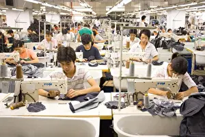 Manufacturing Prints: SHENZHEN, GUANGDONG PROVINCE, CHINA - Workers sewing Mango jeans