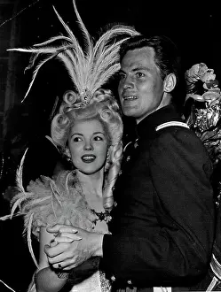 Actress Prints: Shirley Temple dances in feathers while husband John Agar appears in the uniform he wears in RKO's forthcoming Fort