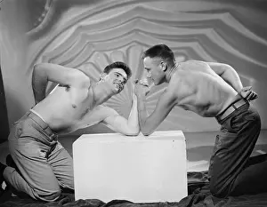 Attractive Prints: Two Shirtless Bodybuilders Arm Wrestle c.1954